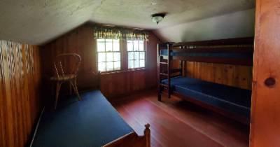 Lodge building upper floor bedroom with twin beds